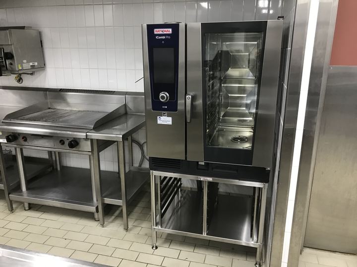 Rational iCombi Pro on stand beside griddle